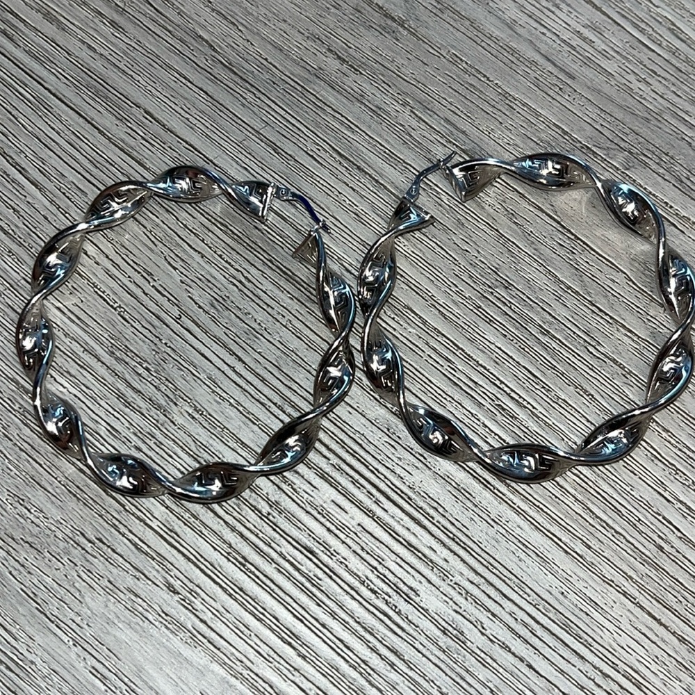 .925 sterling silver round twist hoop earrings made in Italy. Light weight.